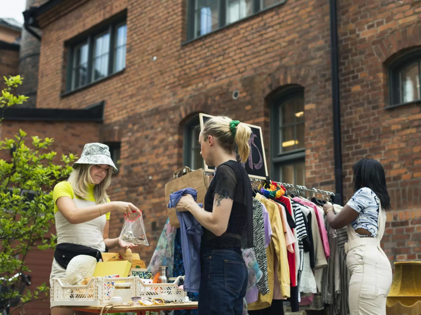 Three girls shopping for clothes