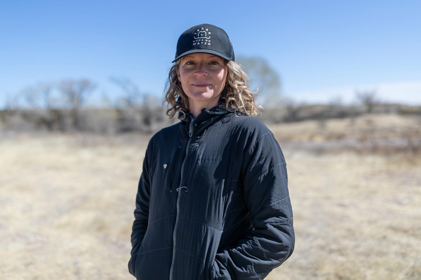 Vanessa Puig-Williams standing in the Texas desert