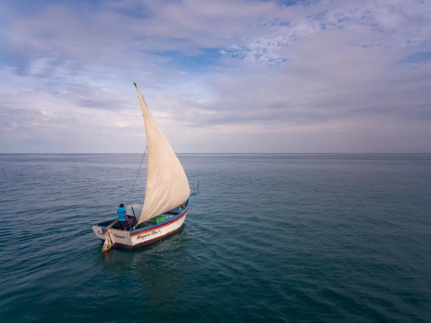 A sailboat in the middle of open ocean