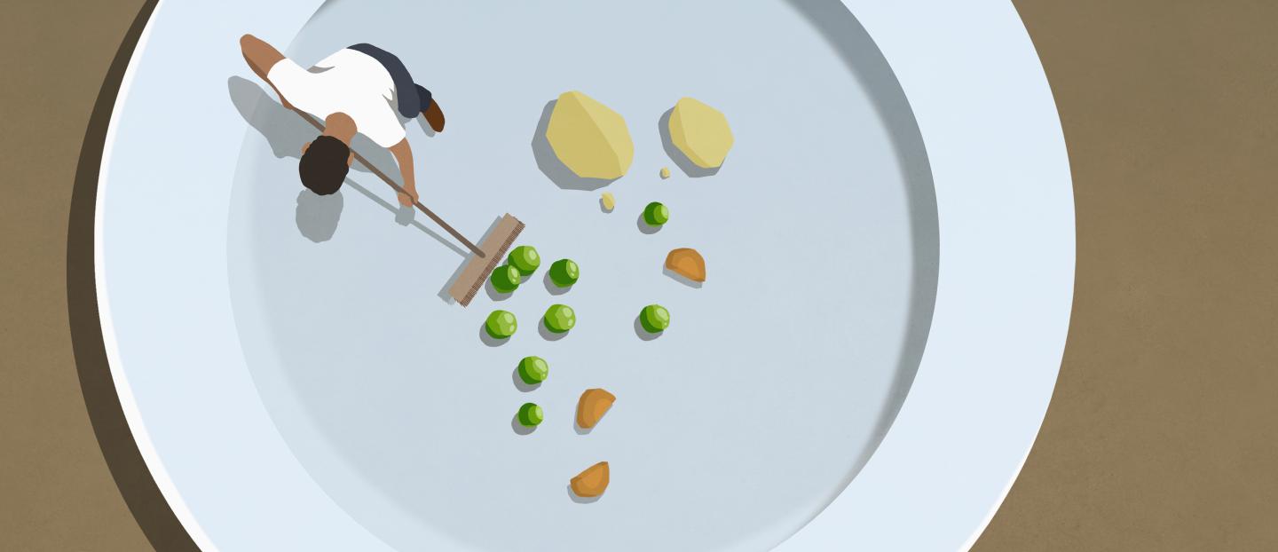 Illustration from above of a man using a broom to sweep a few leftover peas off a pate