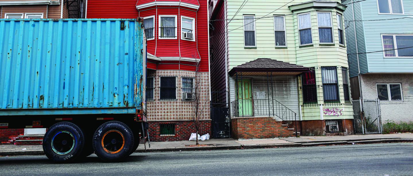 Trucks are seen driving through the Ironbound district near the intersection of Hawkins St. and Ferry St. in Newark, in Newark, NJ, on November 18, 2015. The rise in truck and port traffic has prompted residents and environmental groups to demand that the EPA does more to protect people from the resulting increase in smog.