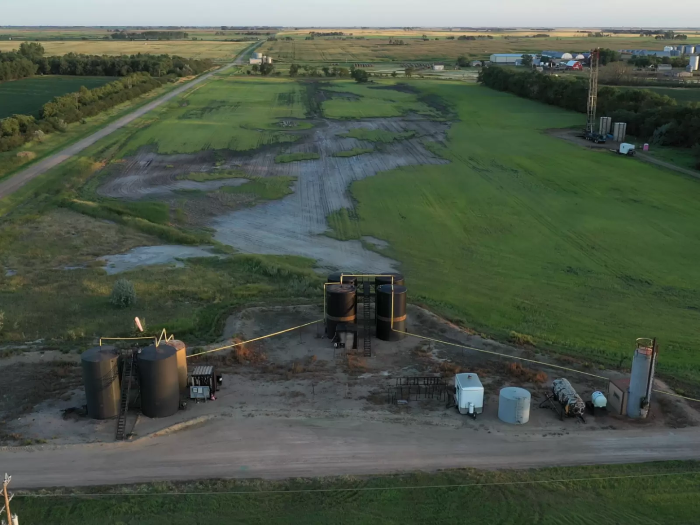 Oil slick spreading over green farmland in North Dakota