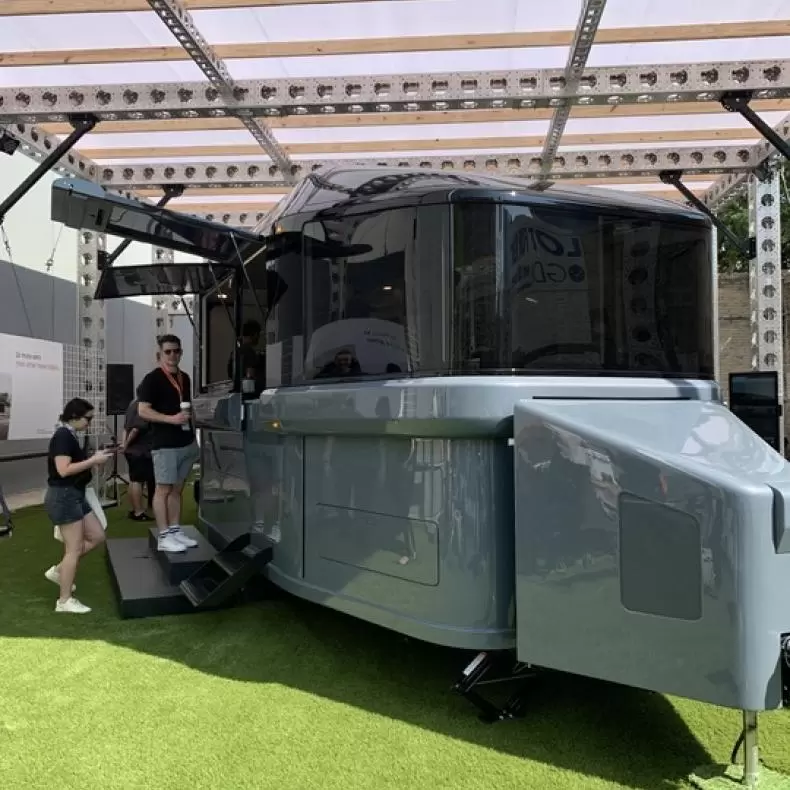 a photo of the sleek, black and silver Lightship L1 parked in an exhibition space at SXSW