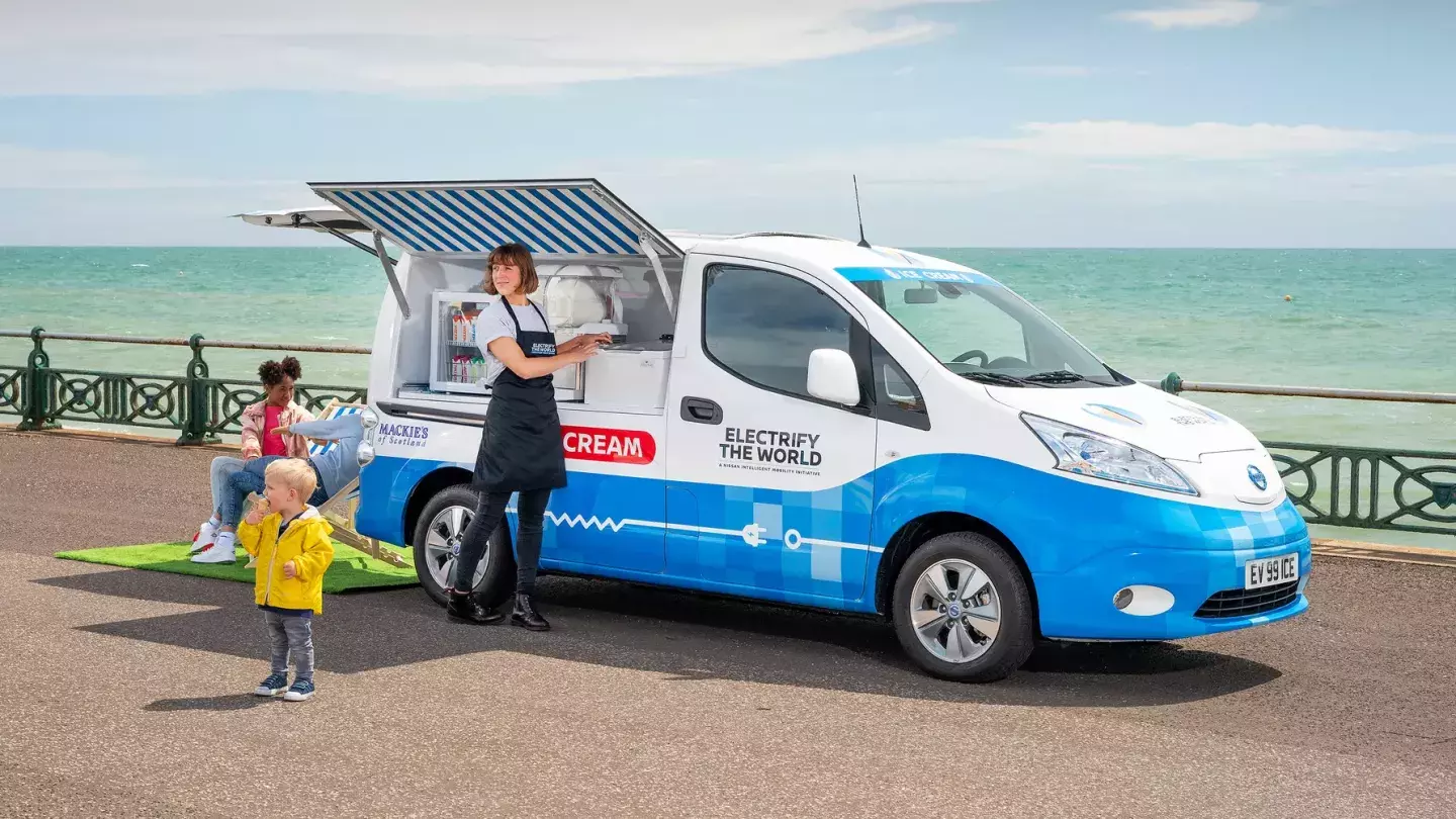 An electric ice cream truck in the U.K. serves up treats to little kids