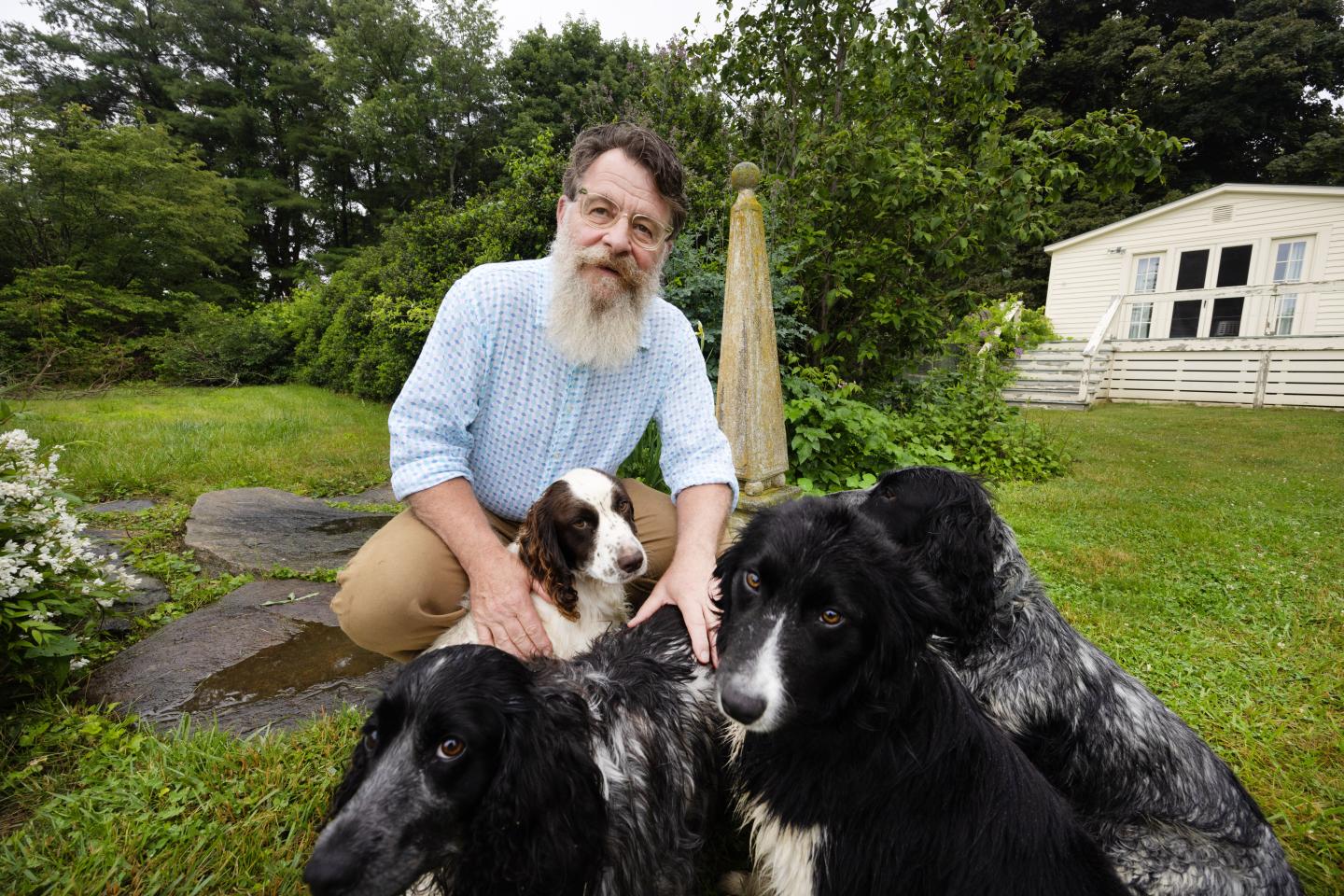 James Shepherd on his farm with his dogs