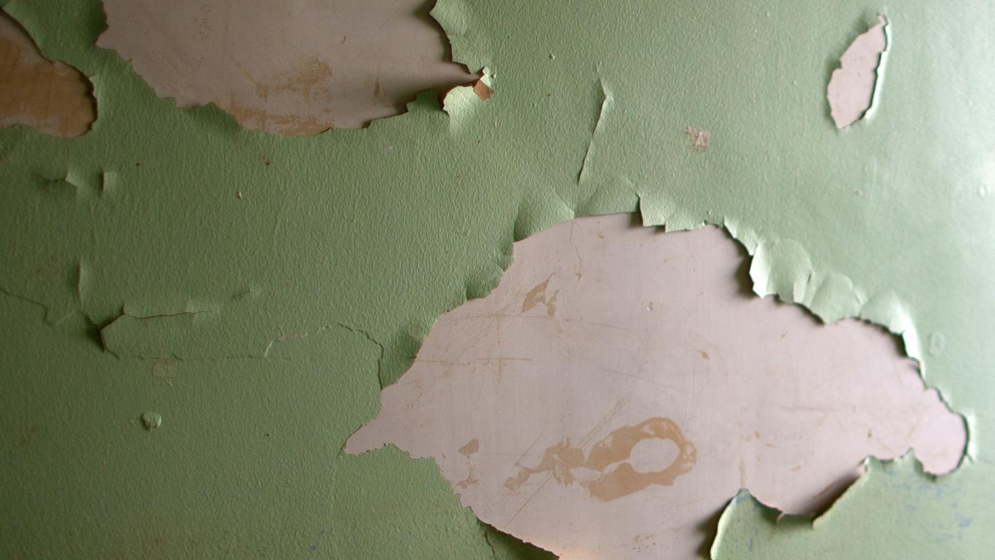 Paint peeling off a wall