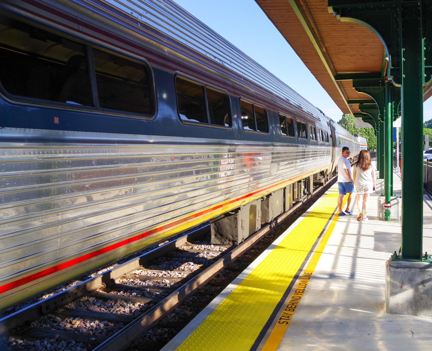 An Amtrak train rush at a station