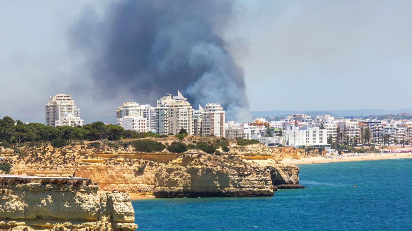 A forest fire near a city in Algarve, Portugal