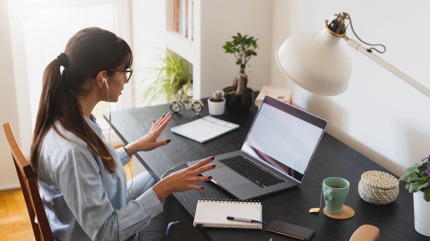 A person sitting at a desk in a home office