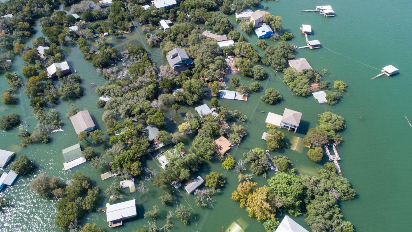 An overhead shot of homes that have been entirely flooded by water