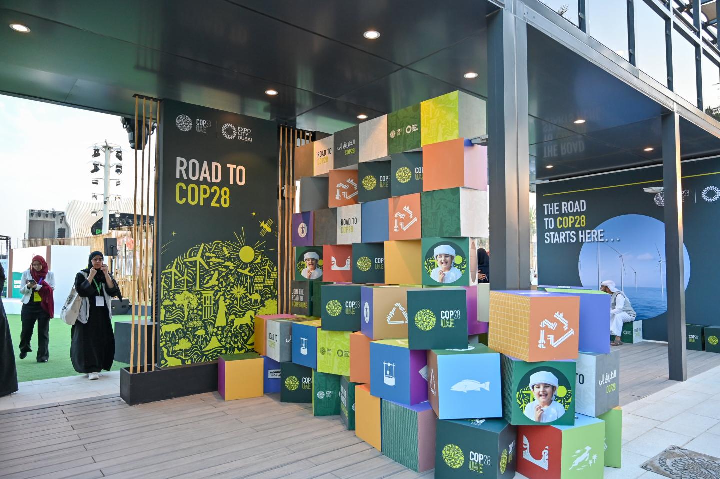 An entry way with Road to COP28 on the wall