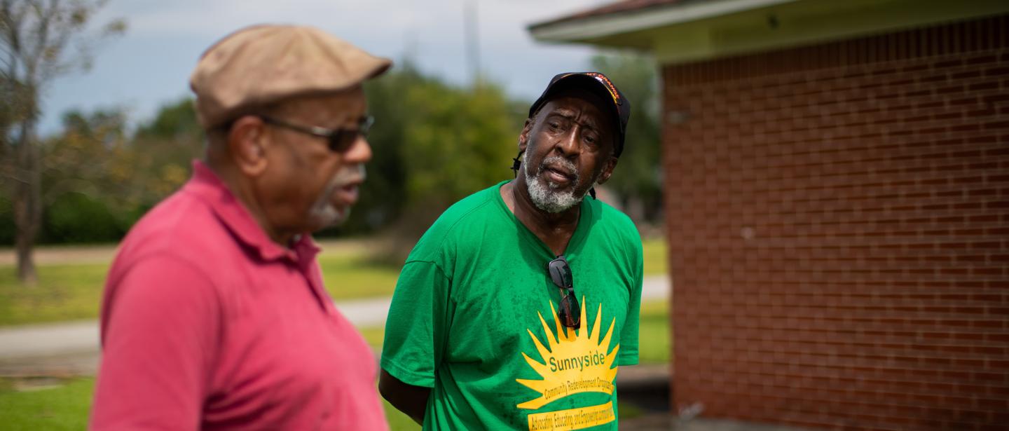 Two community members, one in a Sunnyside Community Redevelopment shirt