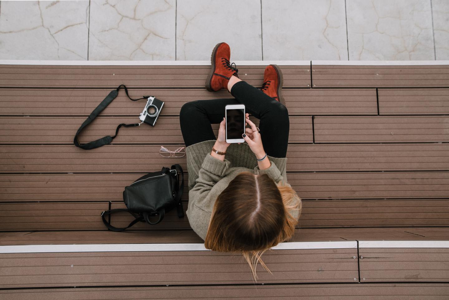 An overhead shot of someone looking at their phone