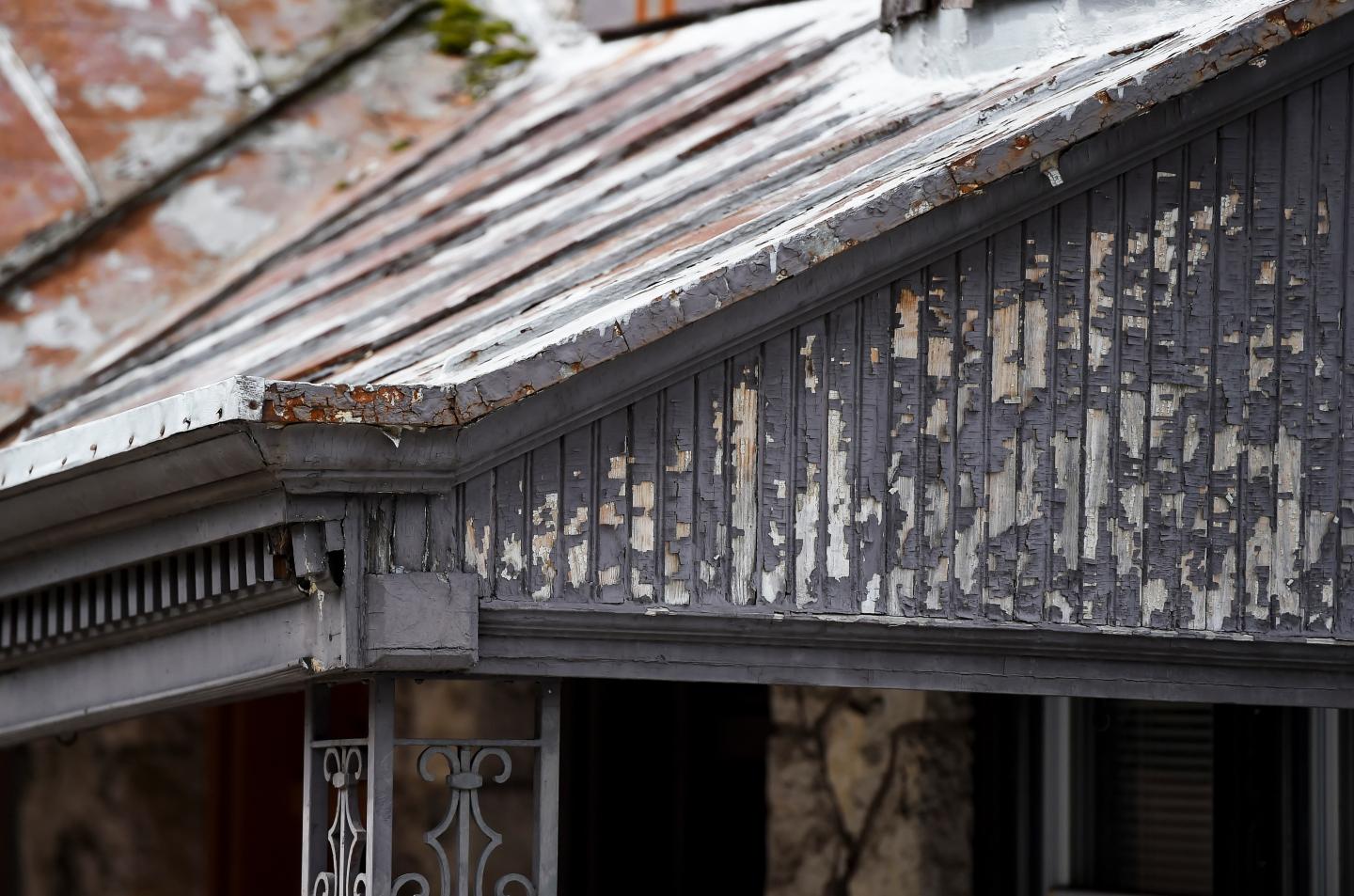 Paint peeling off a house