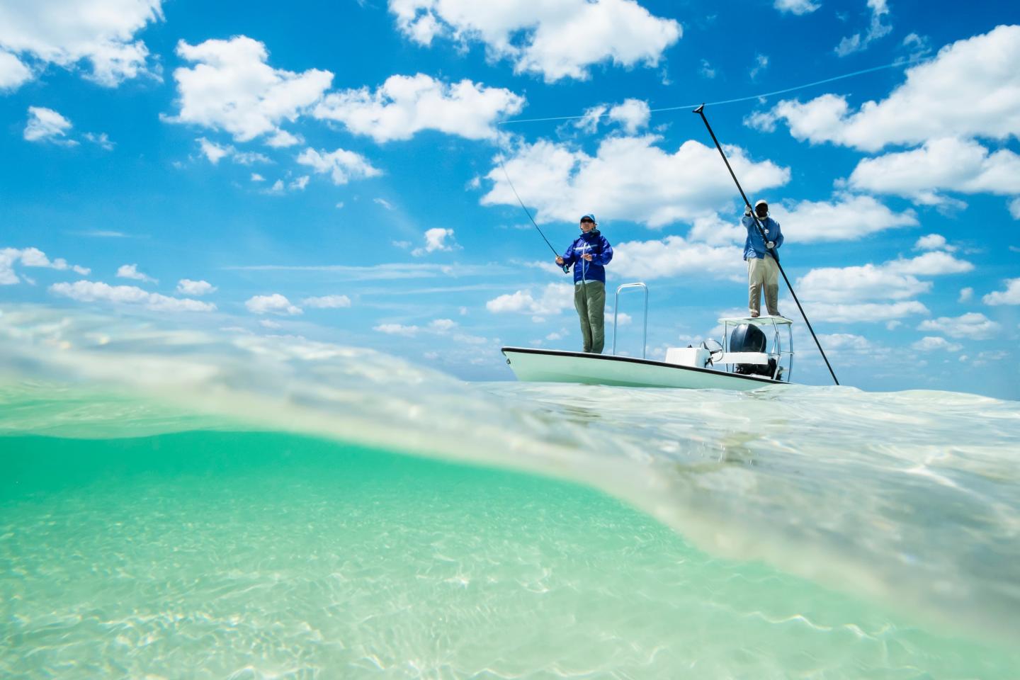 Two people fly fishing in the Bahamas