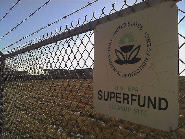 A fence with a Superfund sign on it