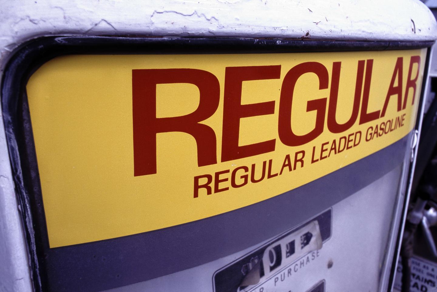 A old picture of a gas pump with leaded gasoline