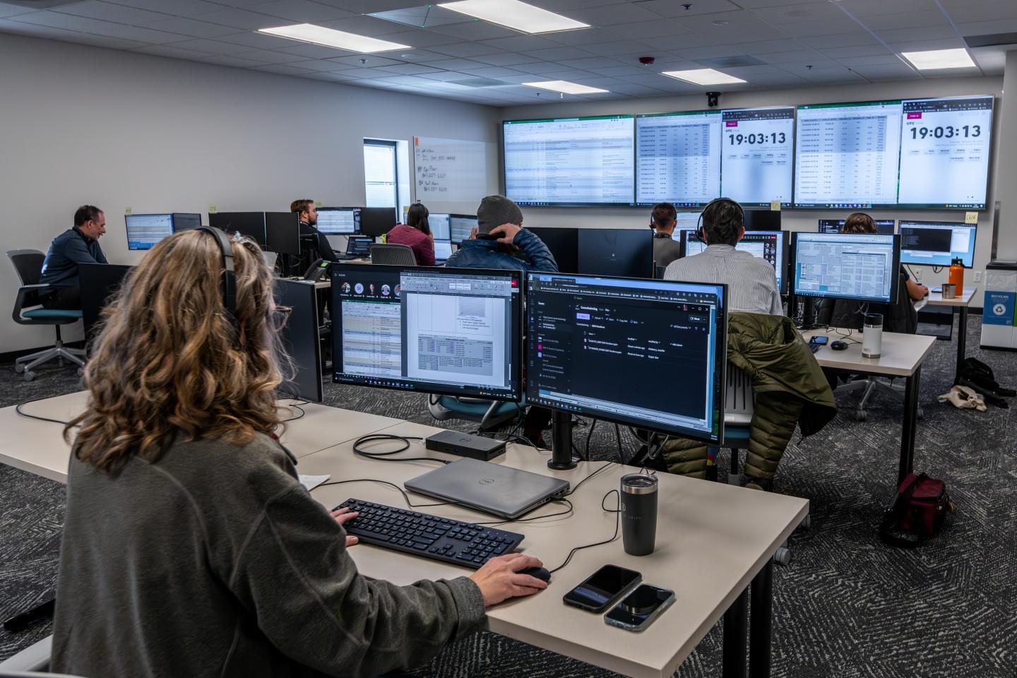 A group of scientists sitting at computers 