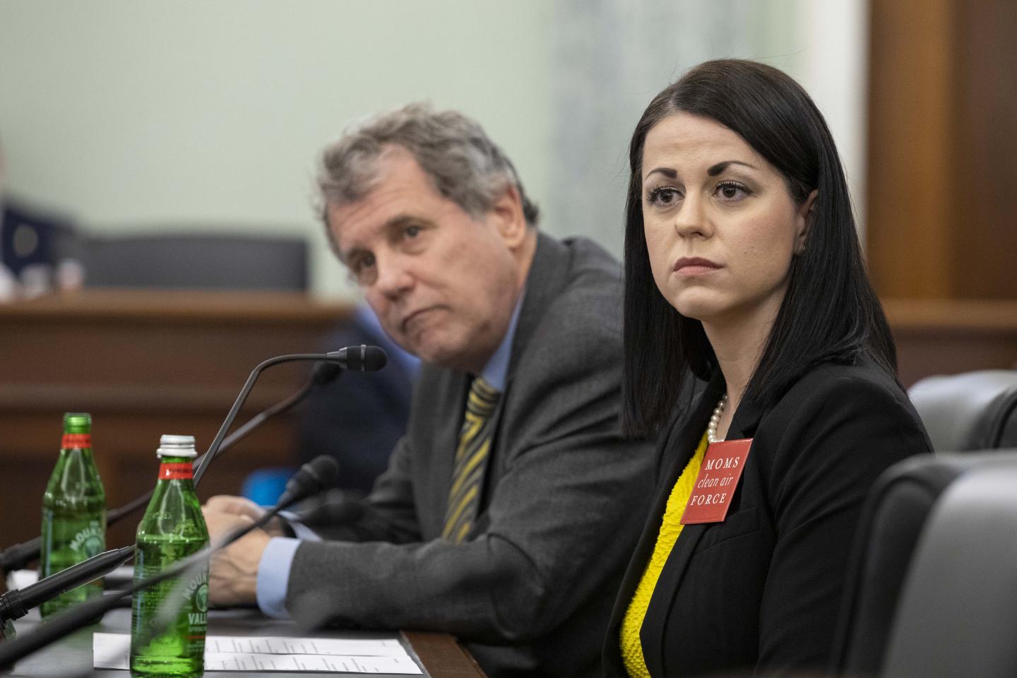 Misti Allison sitting at a senate table in the middle of testimony with Sherrod Brown sitting next to her