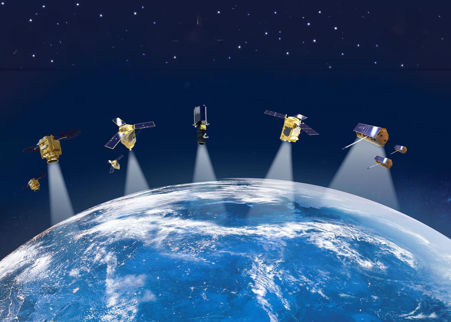 A computer image of several satellites above the Earth