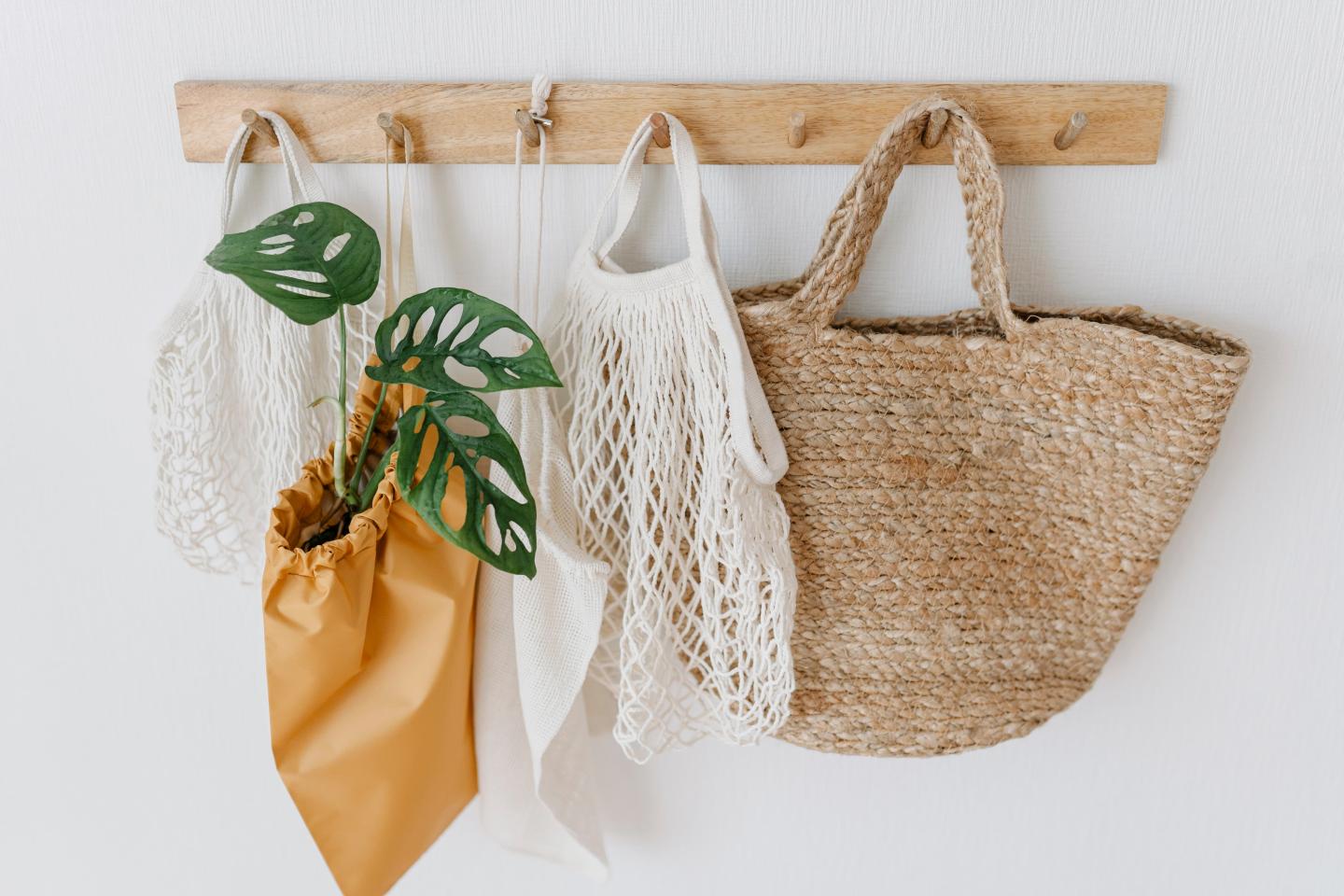 Tote bags hanging on hooks