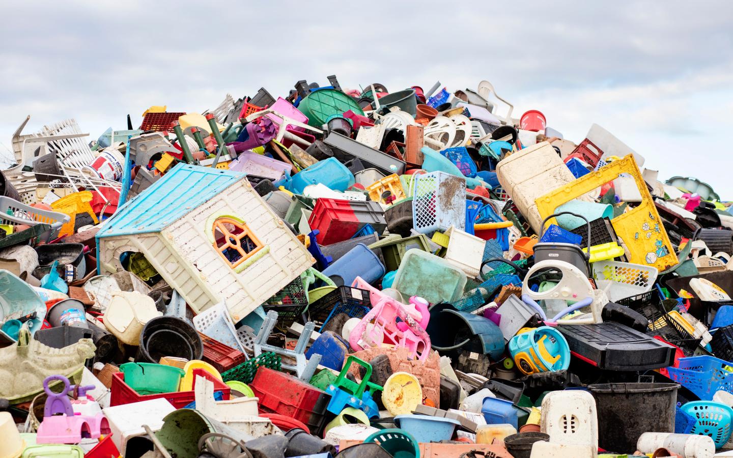 A mountainous pile of plastics — toys, doll houses, baskets and more