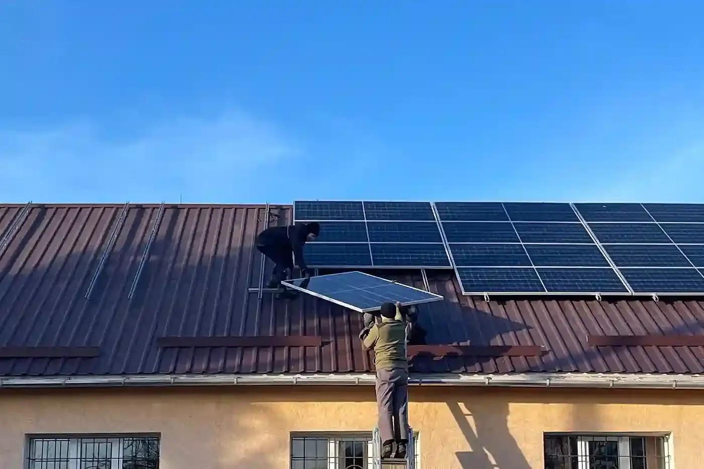 Solar panels being installed on a rooftop
