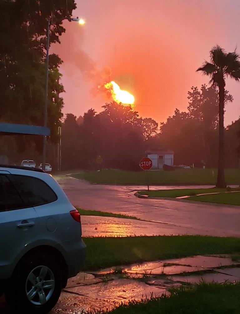 A cell phone picture of a large flare during a storm