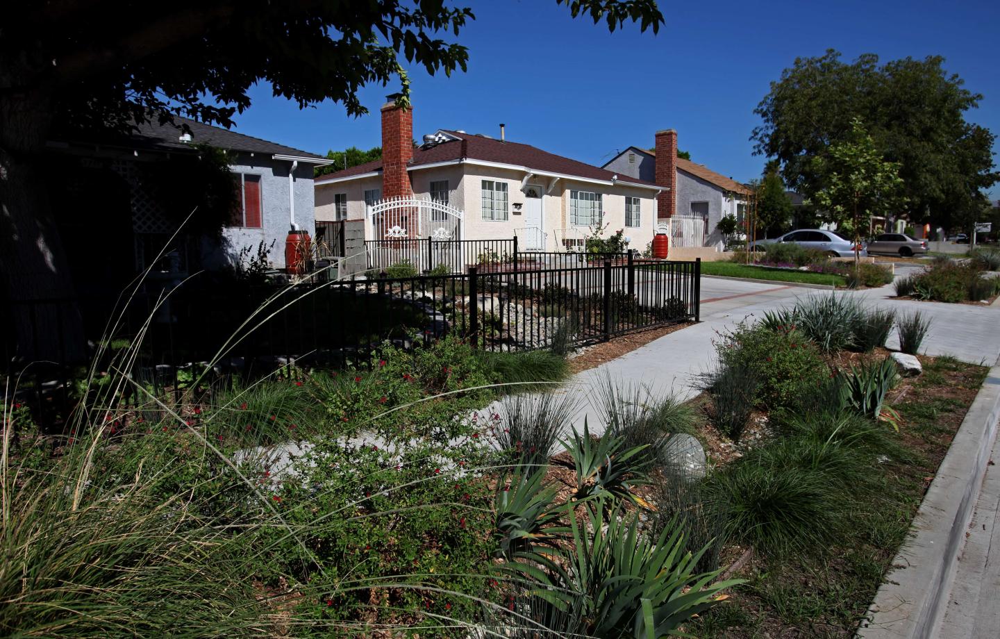 A home with a permeable walkway in front of it