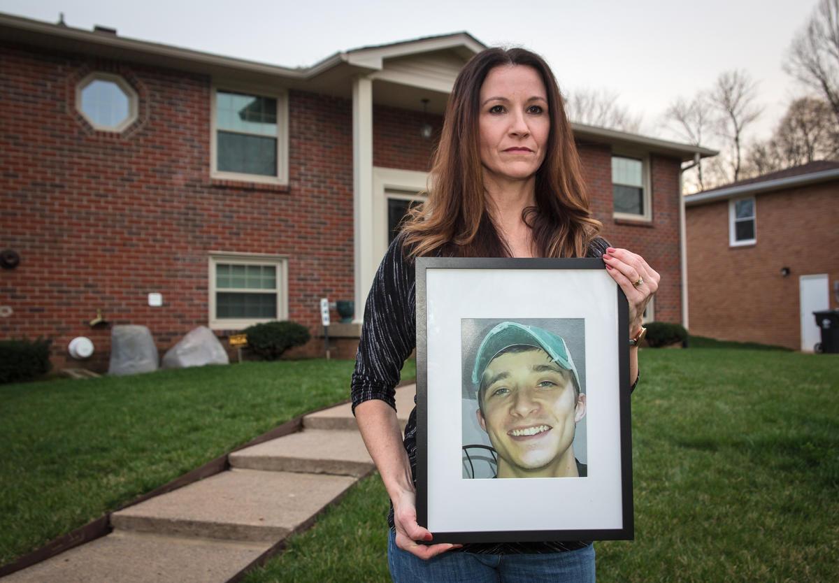 Wendy Hartley holding a picture of her son