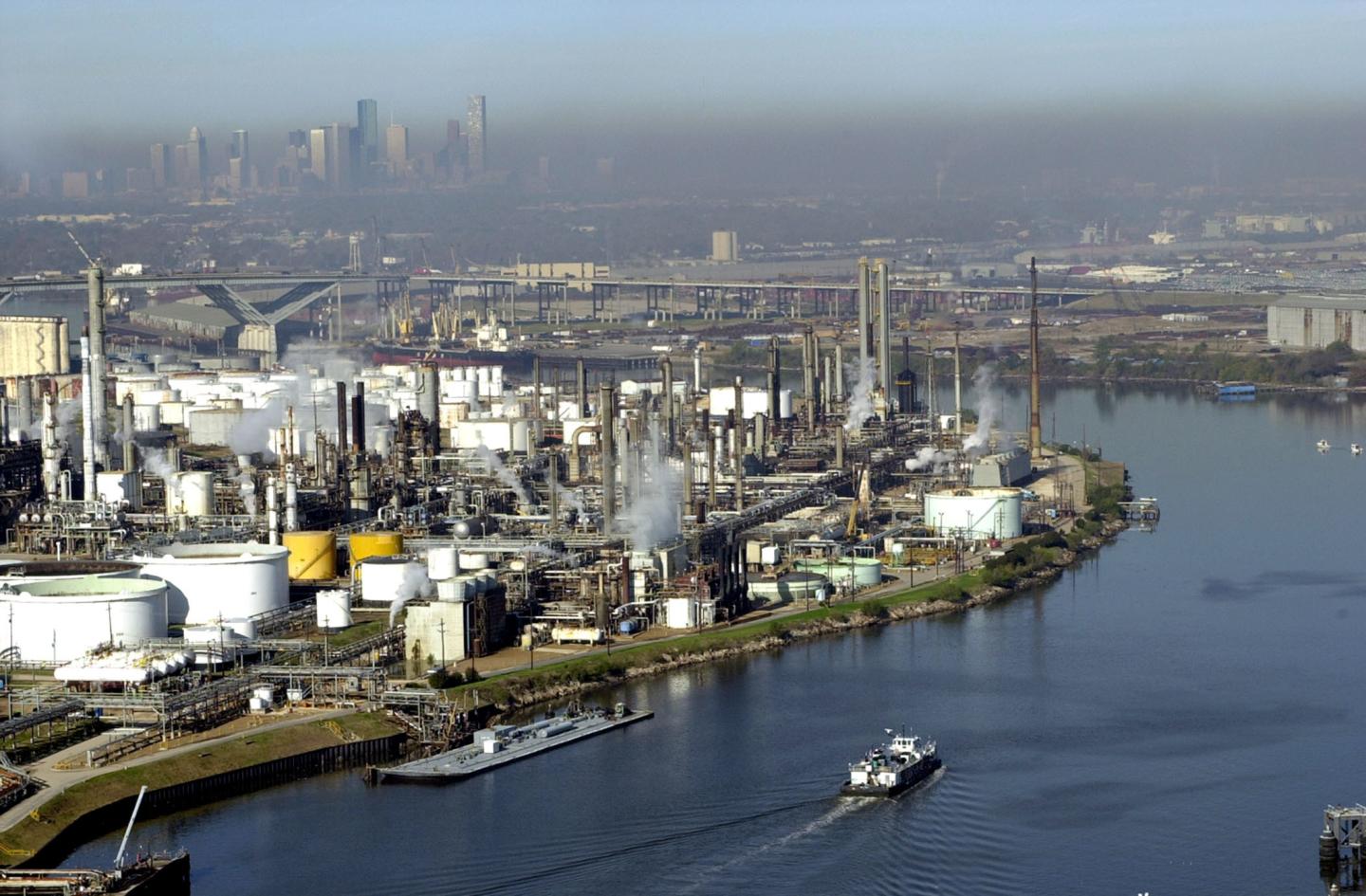 An aerial view of the Houston Ship Channel with petrochemical facilities lining the shores