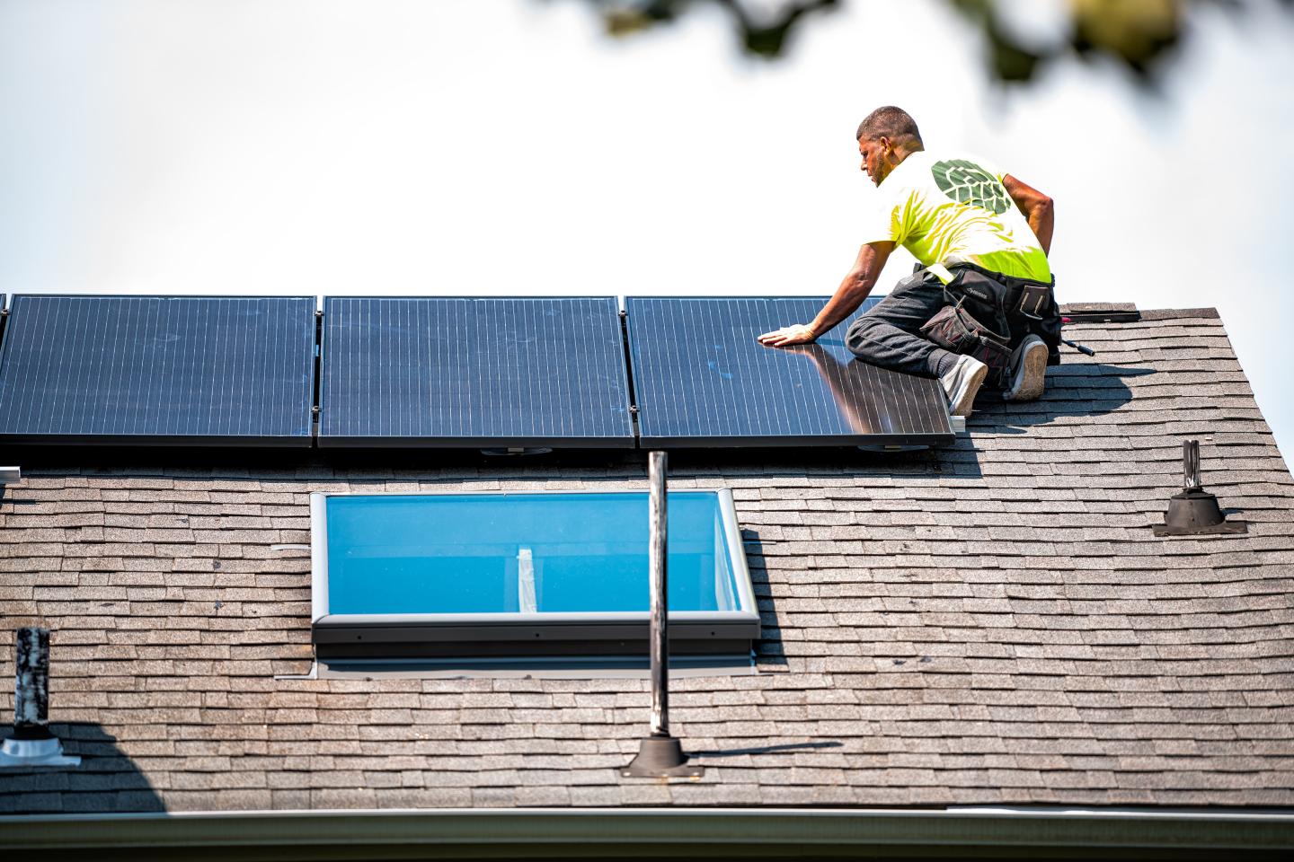 Solar panels being installed on a residential rooftop