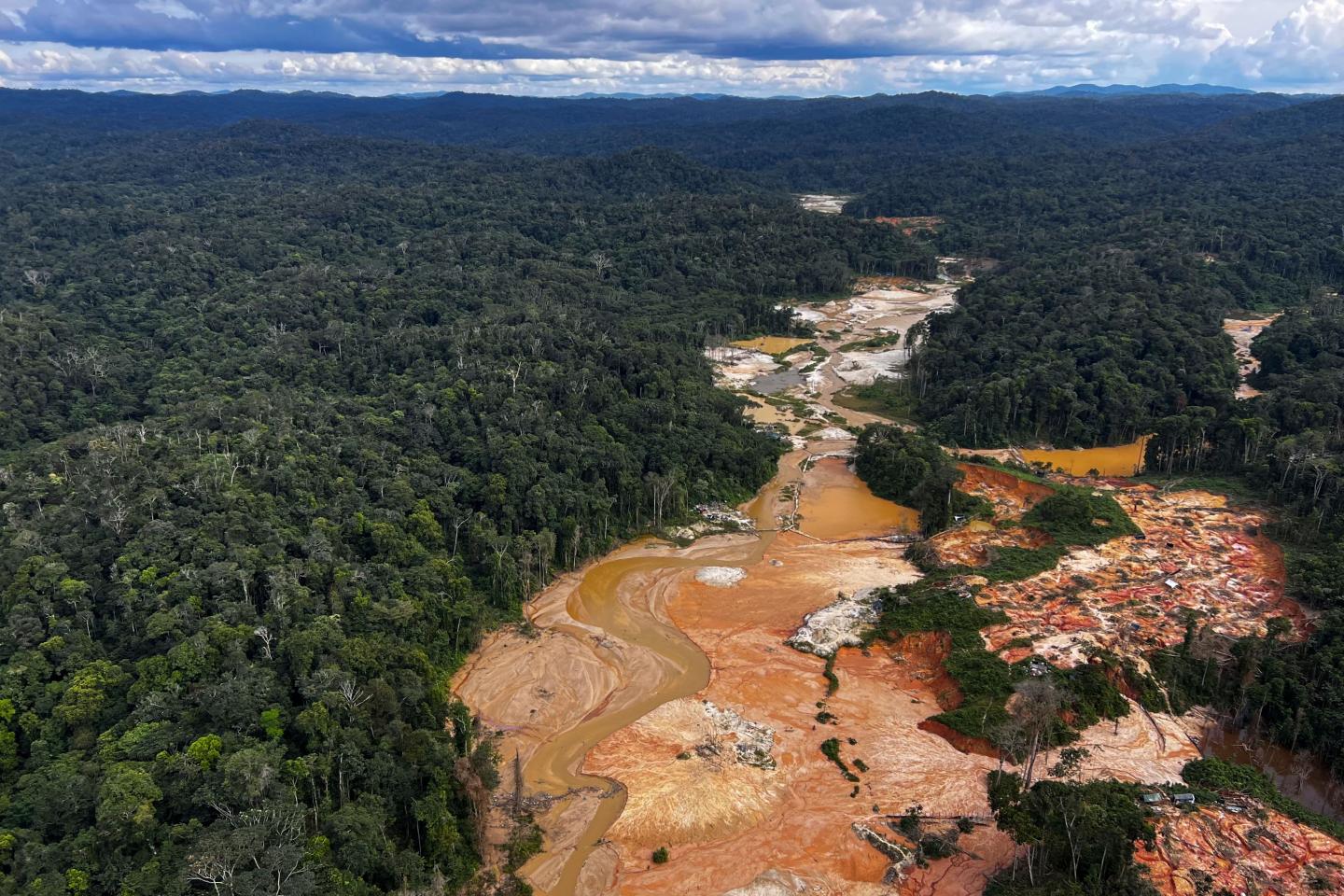 Amazon rainforest split by an illegal gold mining operation