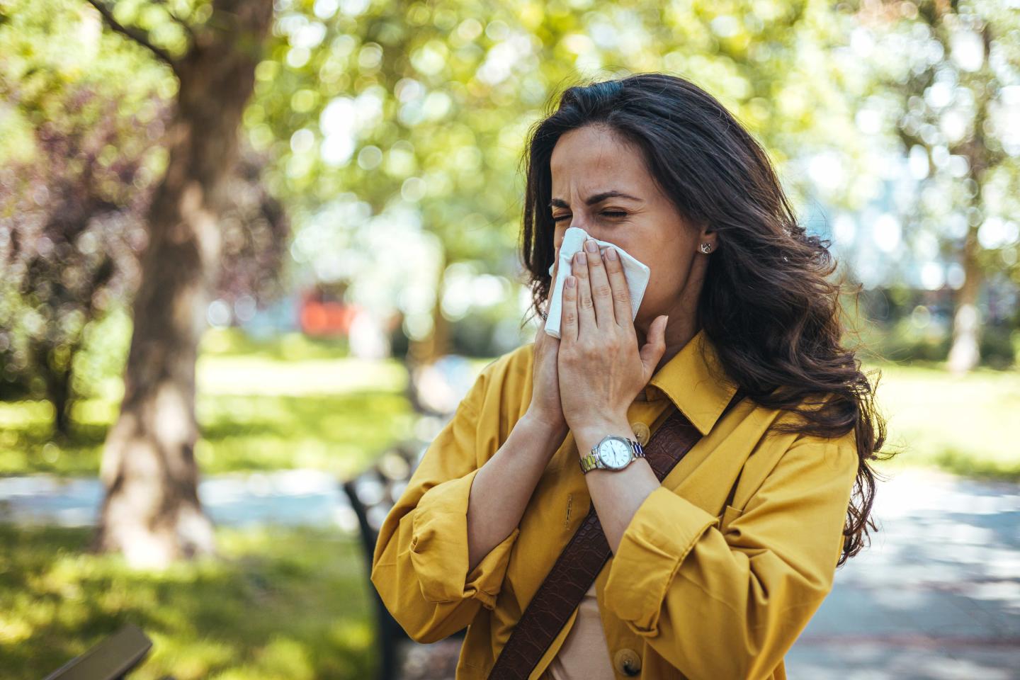 A person blowing their nose