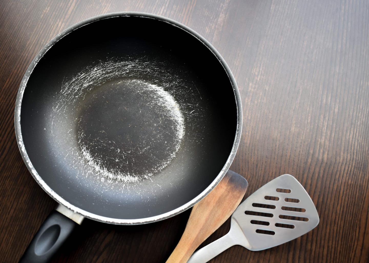 A scratched up non-stick pan