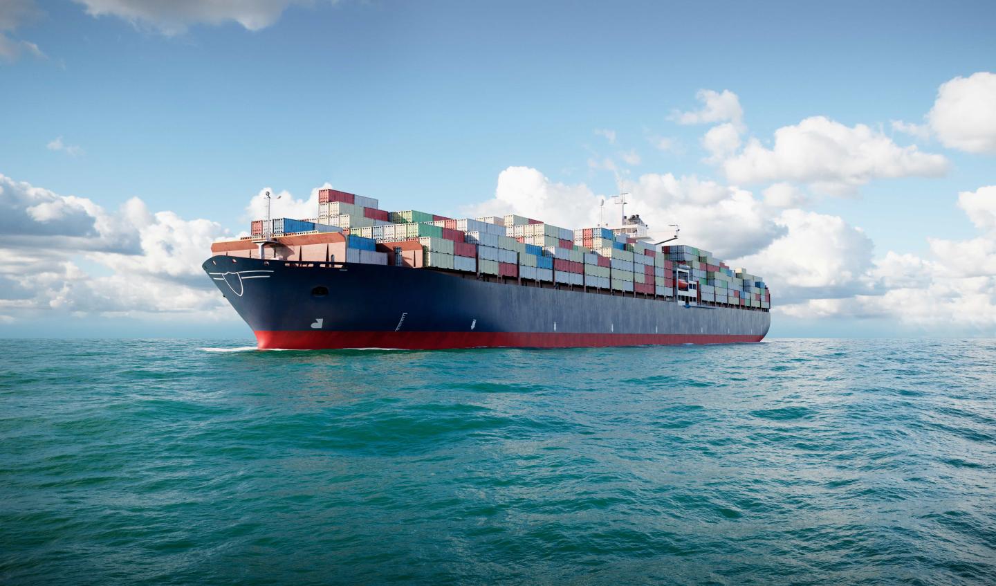 A large ship with shipping containers on it at sea