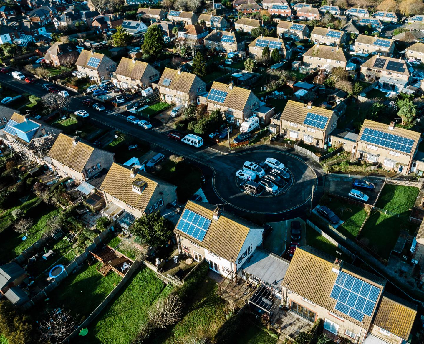 A row of British houses with solar panels on the roofs