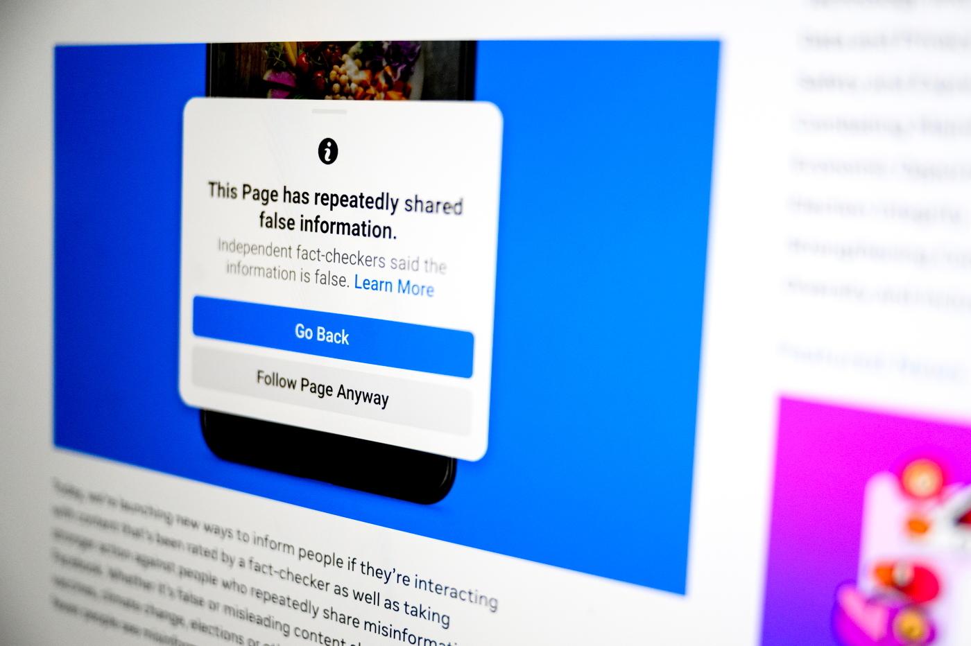 A screen that has "this page has repeatedly shared false information" with the options to go back or follow the page highlighted