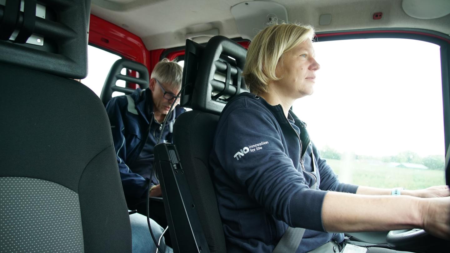 Researchers in a van