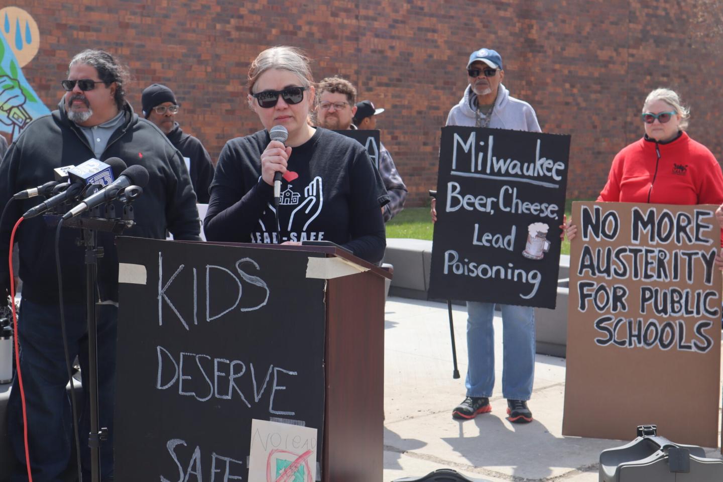 A group of people protesting the lead found in Milwaukee schools