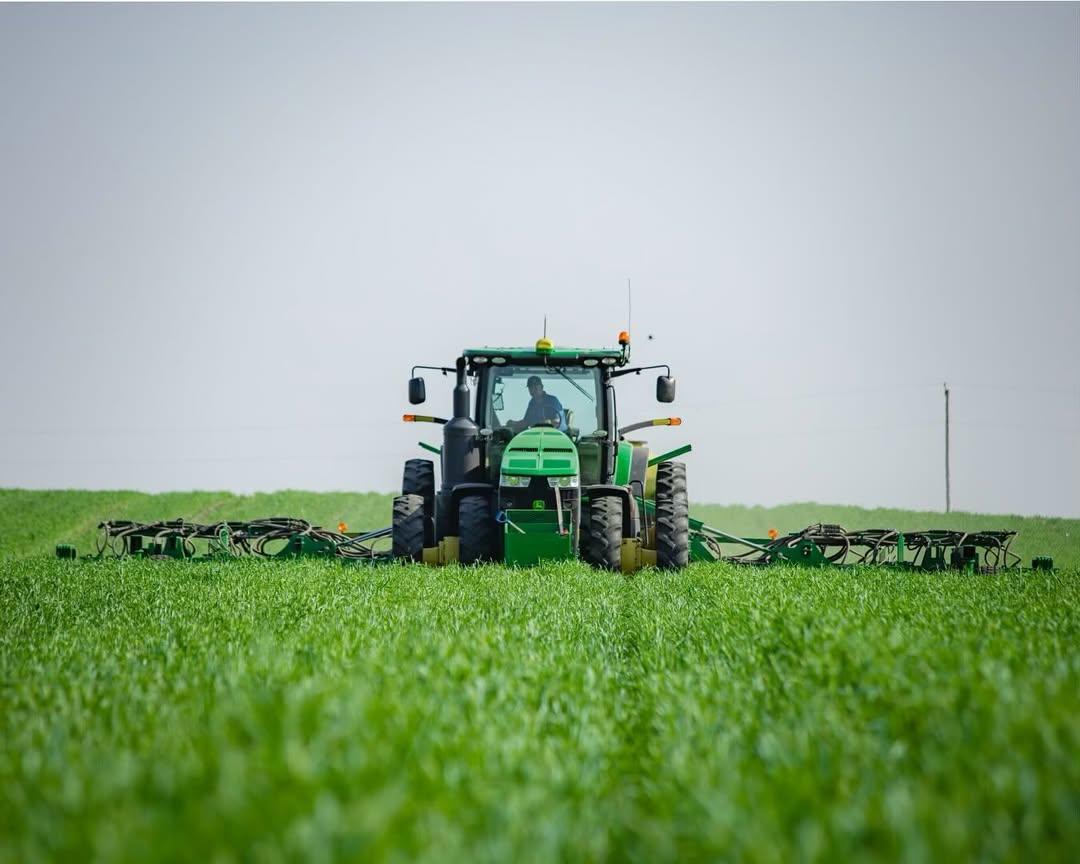 Tractor tilling and planting green