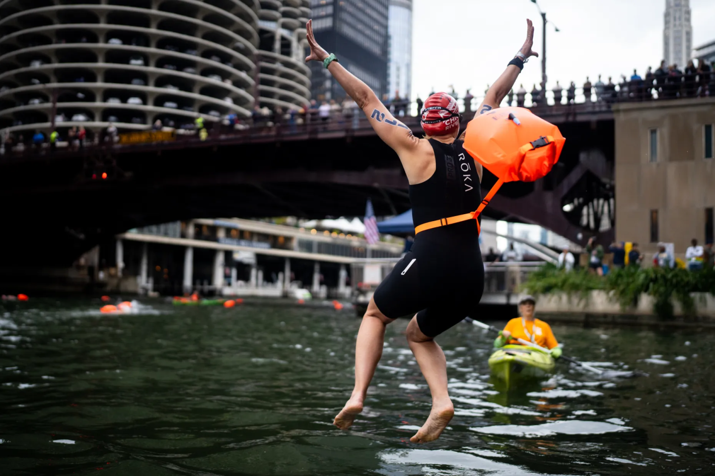 Swimmer leaping into the Chicago River