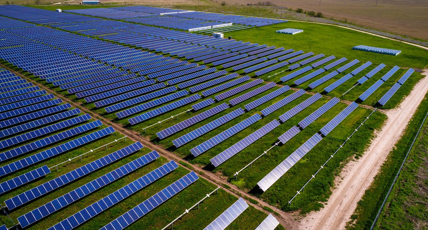 Aerial drone views above Solar power plant producing clean energy to fight climate change with renewable and Sustainability