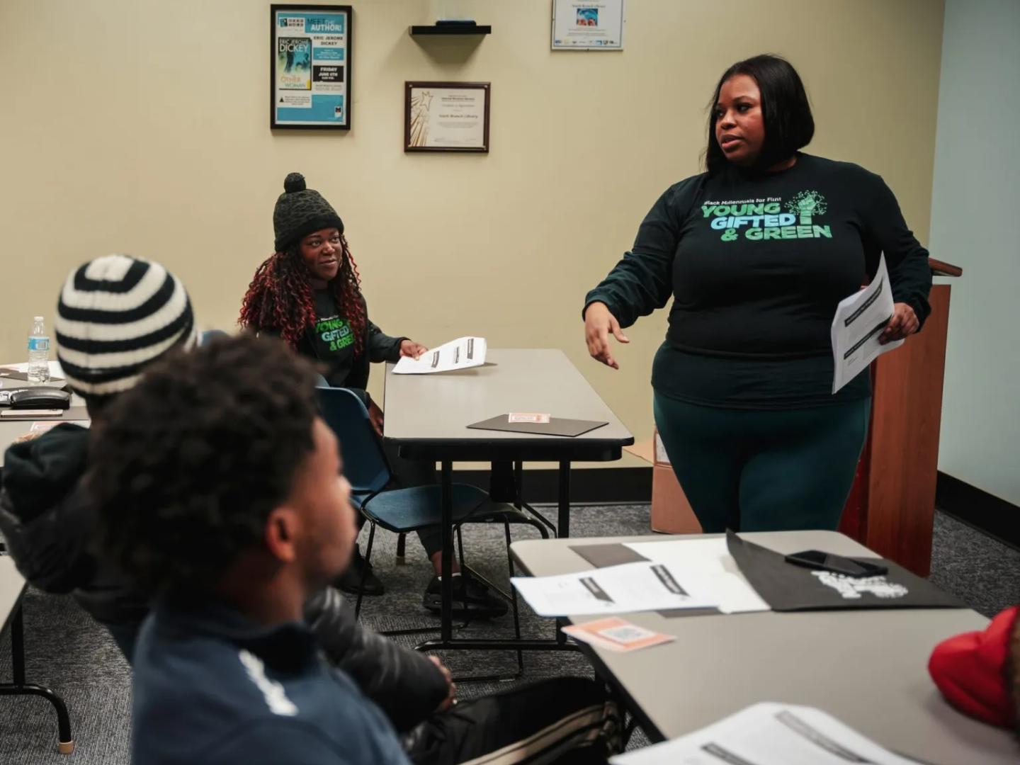 LaTricea Adams talking to a group of people at a meeting