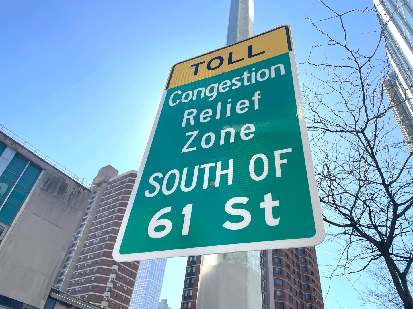 A sign in New York City that reads "Toll congestion relief zone south of 61 street"