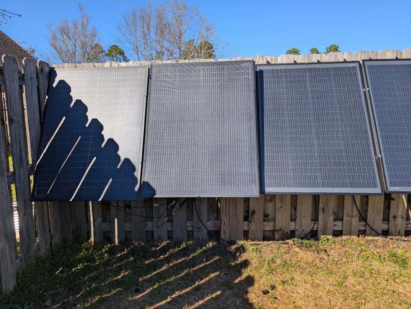 Solar panels attached to a fence