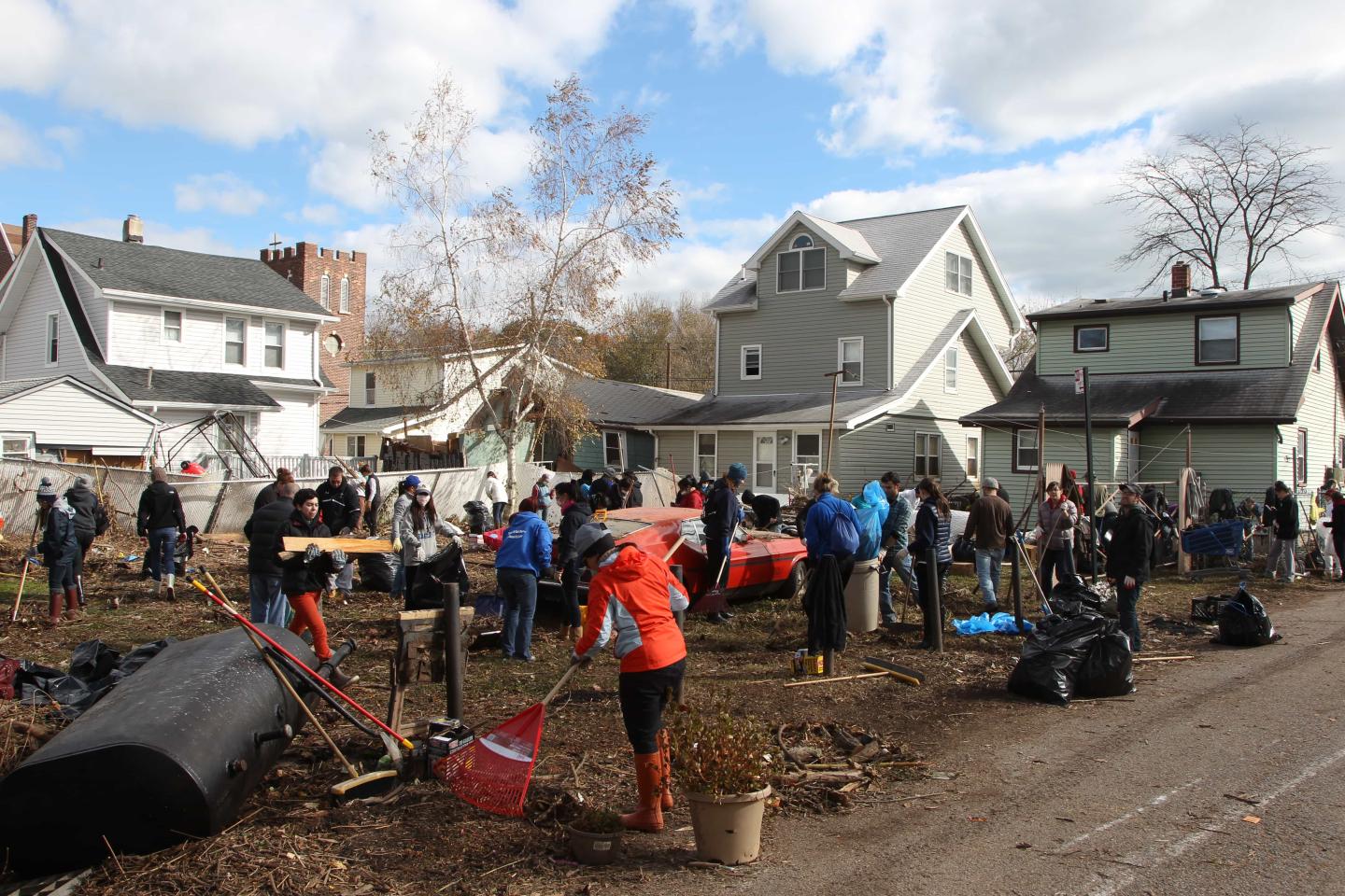 People gathered to clean up litter on the Graham Beach section of Staten Island, New York, in the aftermath of Hurricane Sandy