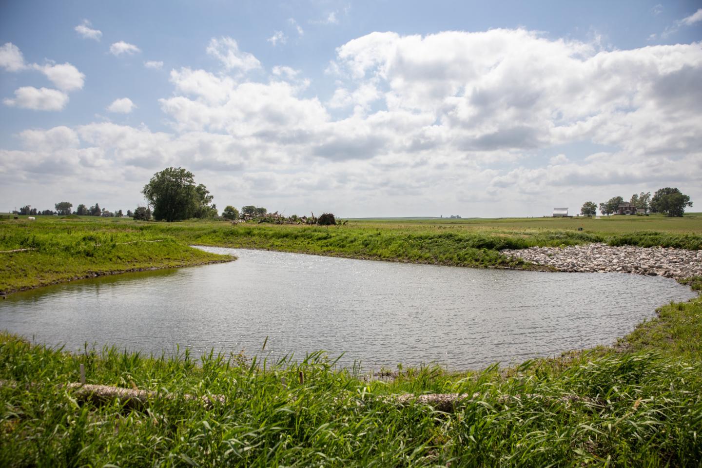 A wetland pooling with water on farmland