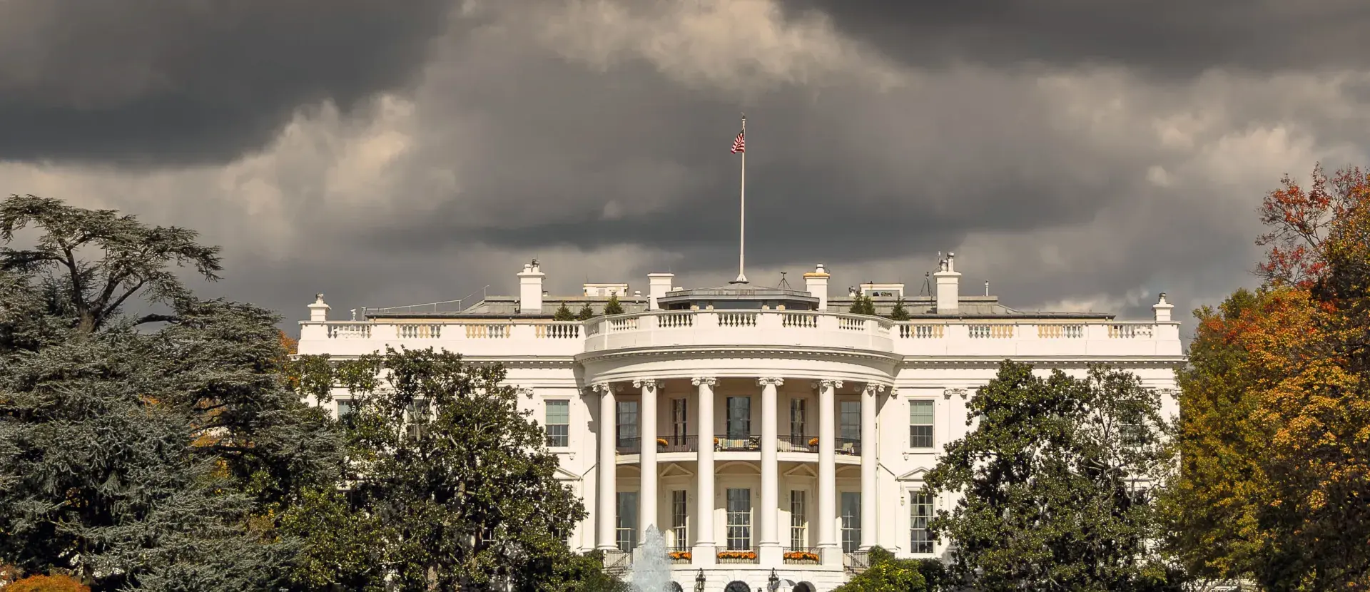 The White House with storm clouds over it