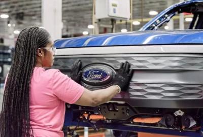 A woman assembling an EV at Ford factory